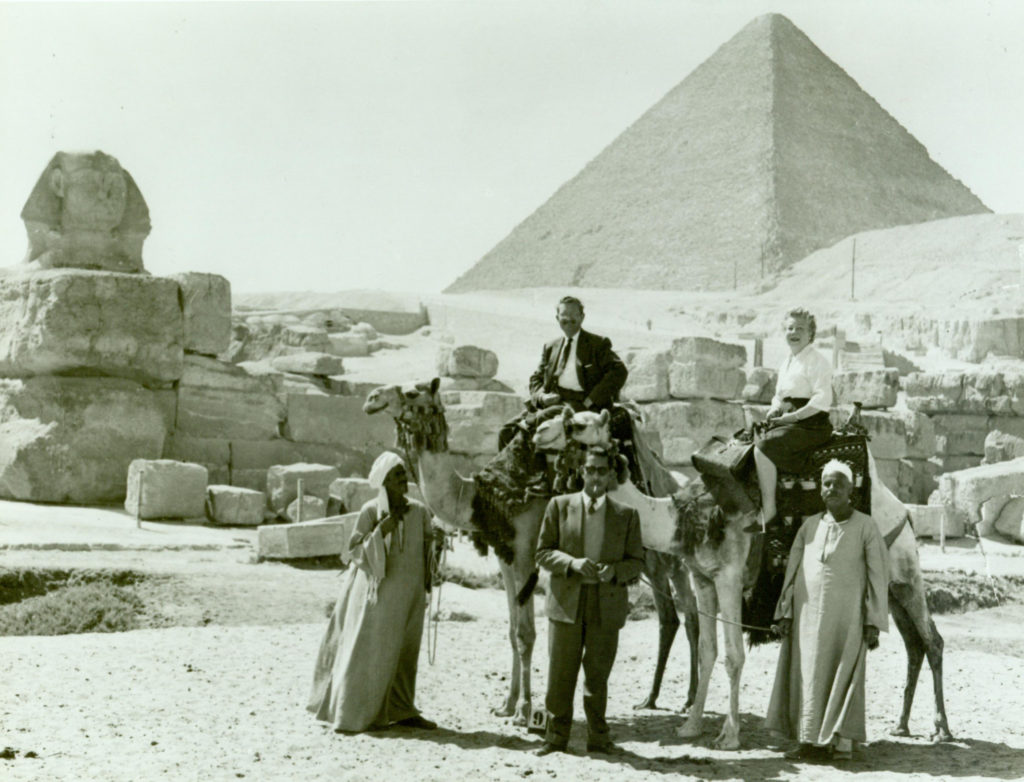 Vance and Anne Kirkland riding camels in Egypt, 1958